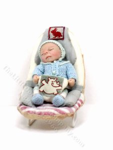 (image for) Sleeping Baby in a Carrier by Catherine Muniere