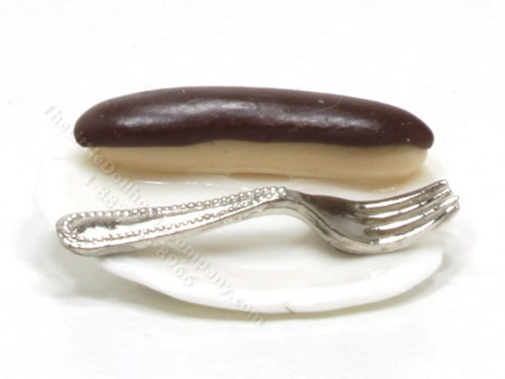(image for) Miniature Éclair on White Plate with Fork by Charlotte Willmott