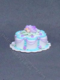 (image for) Dollhouse Scale Model Purple and Blue Flower Cake on a Doily