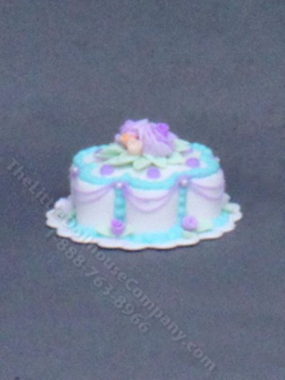 (image for) Dollhouse Scale Model Purple and Blue Flower Cake on a Doily