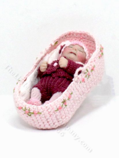 (image for) Sleeping Baby in a Knit Bassinet by Catherine Muniere