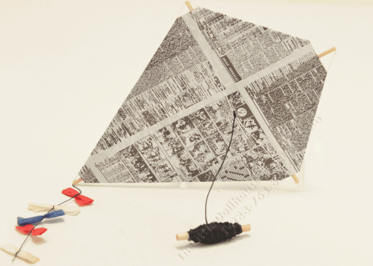 (image for) Miniature Newsprint Kite with Spool and Decorative Bows.