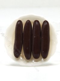 (image for) 4 Miniature Éclairs on White Ceramic Plate by Charlotte Willmott