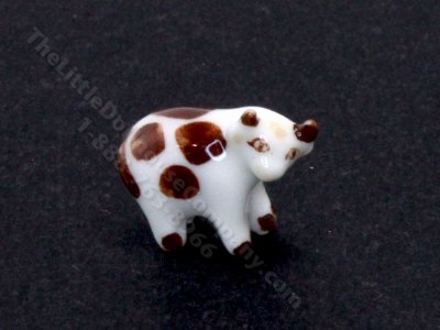 (image for) Miniature Brown and White Ceramic Cow Figurine