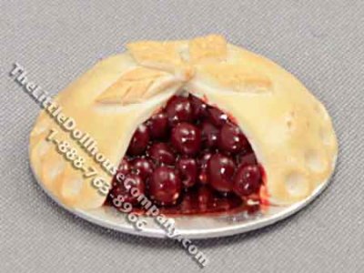 (image for) Miniature Sliced Cherry Pie on Metal Plate by Charlotte Willmott