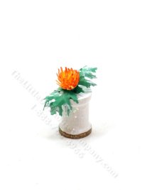 (image for) Miniature Orange Sea Holly in a White Vase