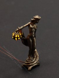 (image for) Miniature Bronze Lady '09 with Amber Light by Jim Pounder
