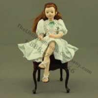 (image for) Sitting Girl in Green Striped Dress by Patsy Thomas