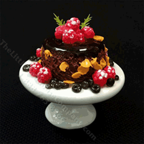 (image for) Miniature Chocolate Cake With Raspberries on Ceramic Pedestal