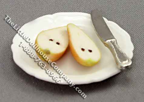 (image for) Miniature Sliced Pear on Plate with Knife by Charlotte Willmott